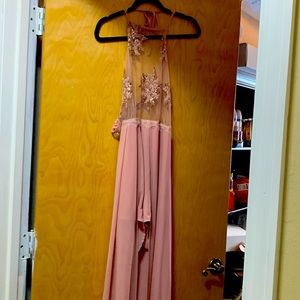 Pink romper shorts with fabric that make it turn into a long dress